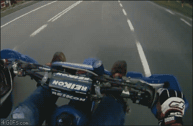 Motorcycle-stunt-bus-low-five.gif
