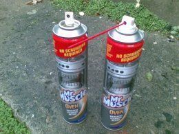 24102011008Mr Muscle tin with original spray head and right WD40 spray head and nozzle