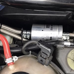 Fuel filter relocated to engine bay